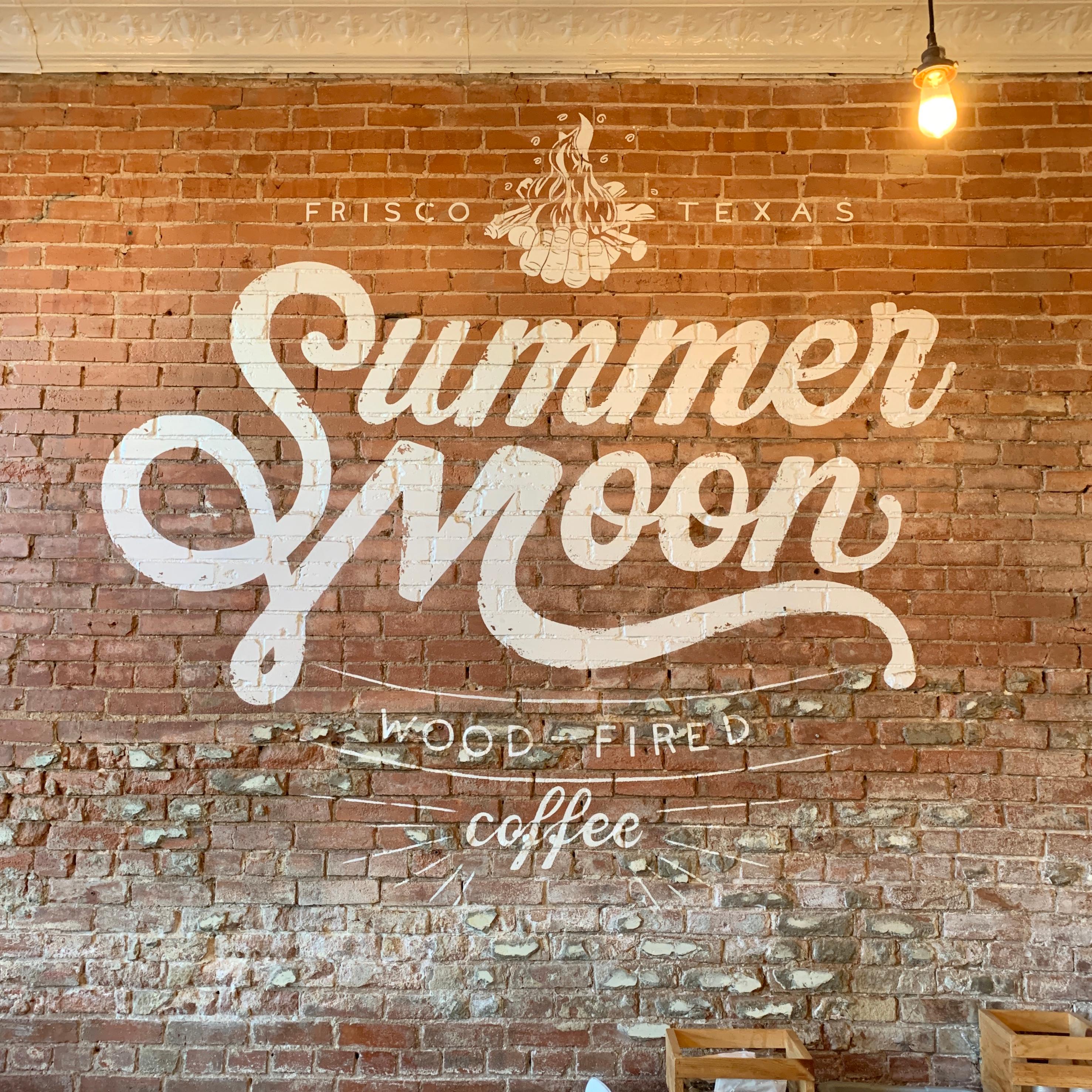 Summer Moon written on a brick wall