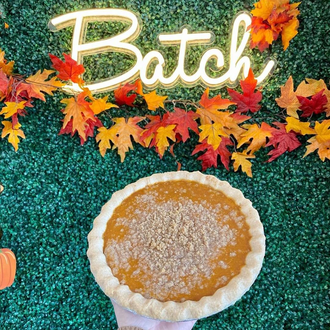 A pumpkin pie and a sign that says Batch