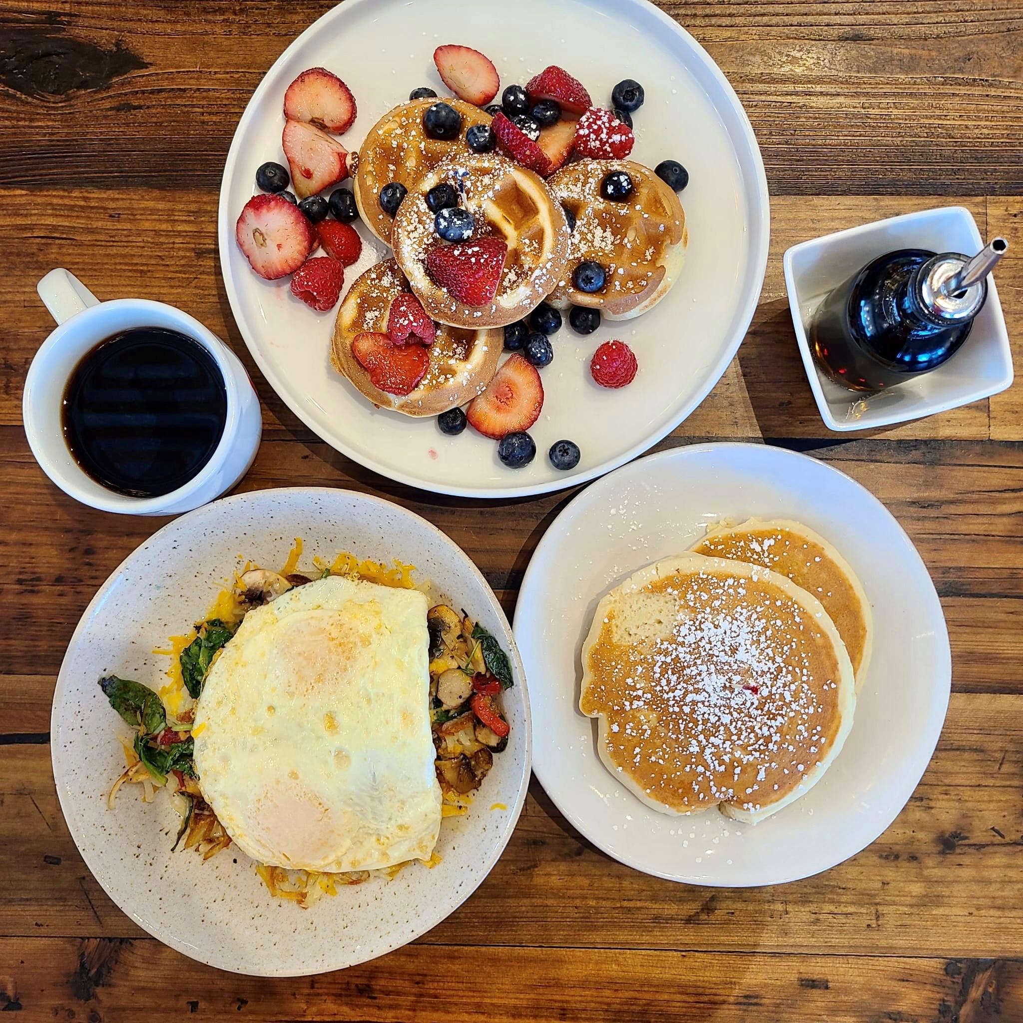 Waffles, pancakes, and eggs with coffee