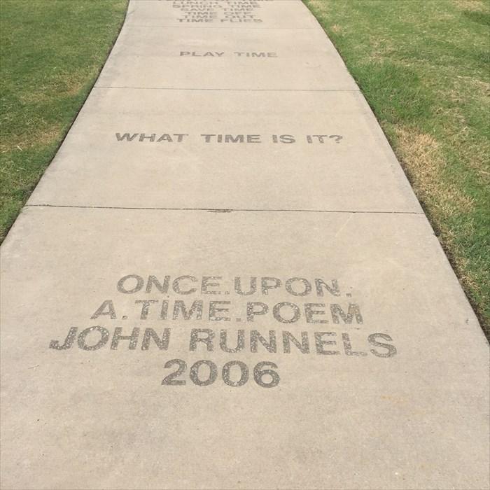 Sidewalk stones with poems on carved into them