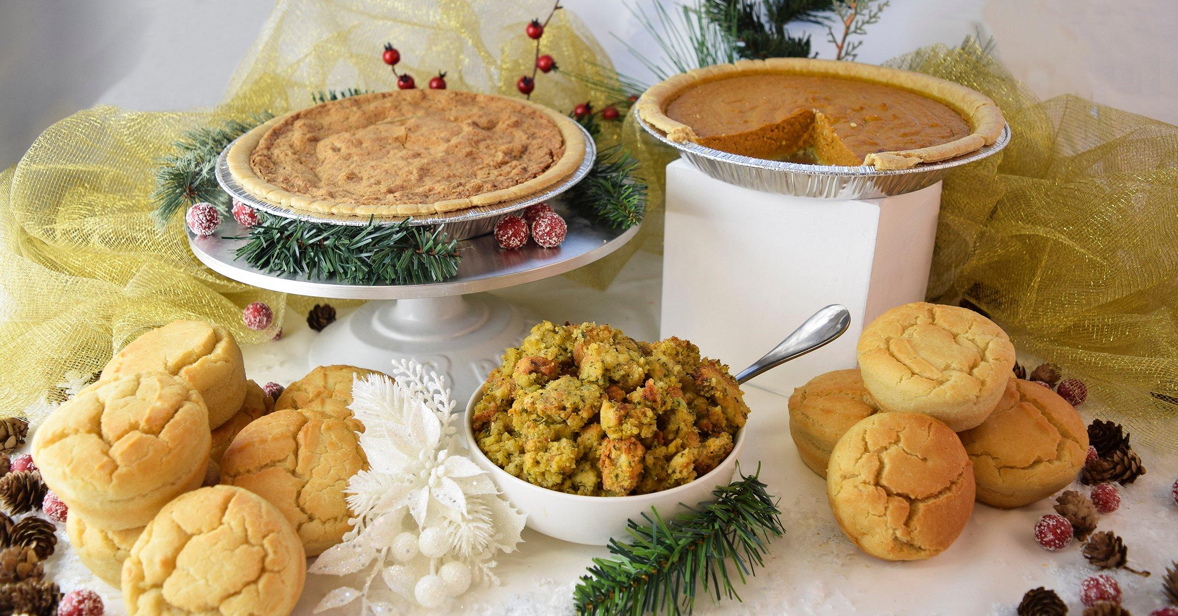 Assortment of Christmas food including pumpkin pie, stuffing, and biscuits