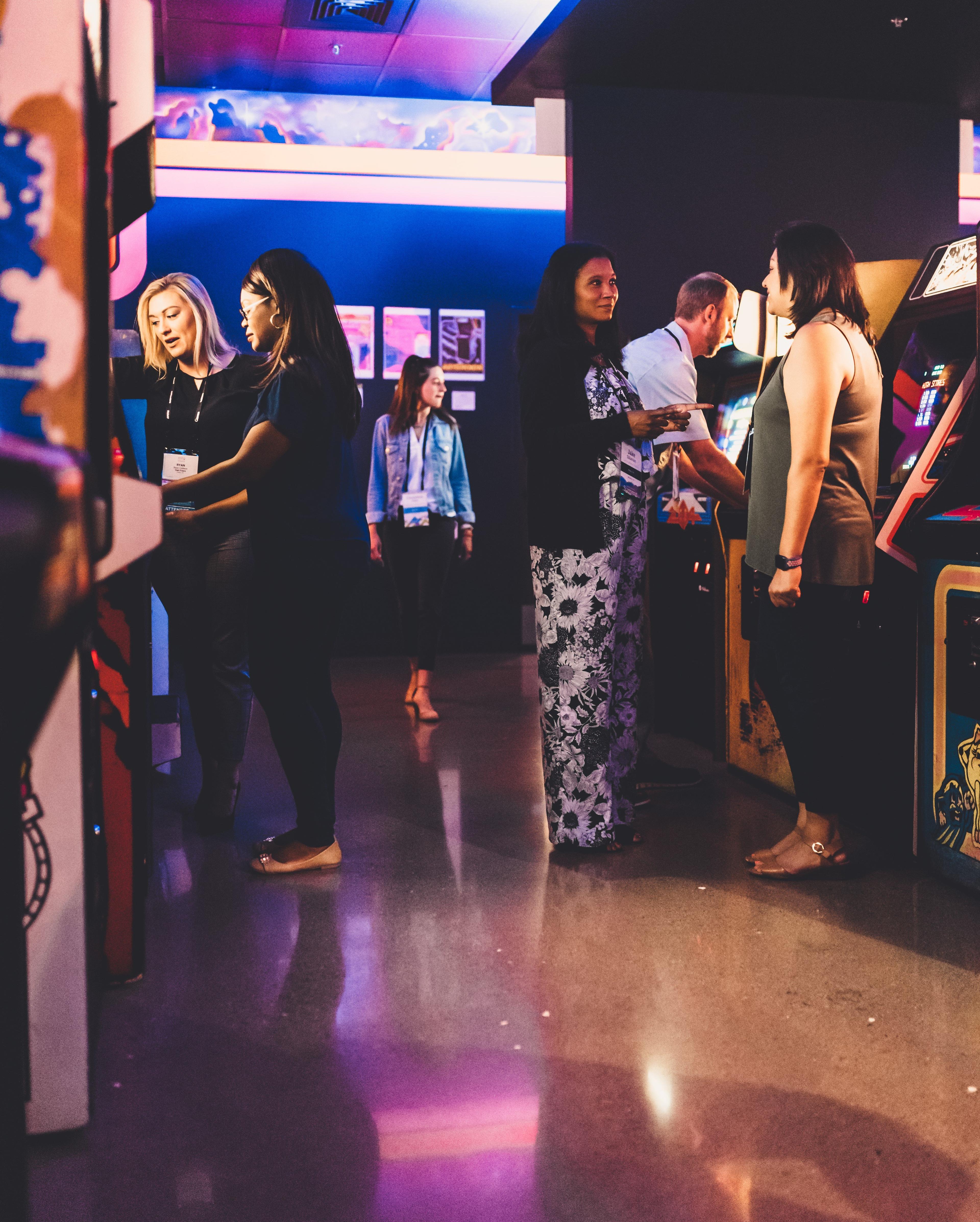 People playing arcade games