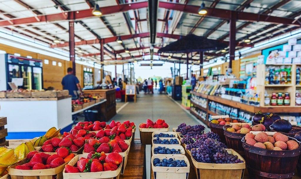 a berry stand at the market