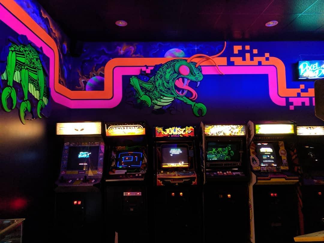 A wall of arcade games